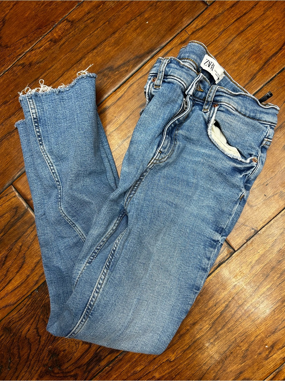 Zara the bootcut Light Blue raw hem denim jeans